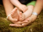 baby feet in mothers hands