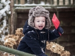 toddler playing in snow