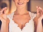 bride holding necklace